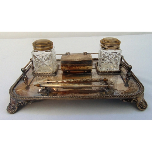 403 - A silver plated rectangular Standish with gadrooned border on four shell feet supporting two cut gla... 