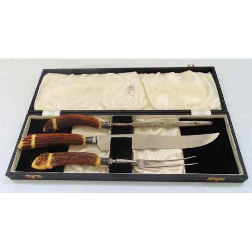 415 - A Mappin and Webb cased carving set with antler handlers and stainless steel blades