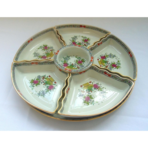 82 - Herend circular hors d'oeuvres tray and six detachable matching dishes decorated with floral sprays,... 