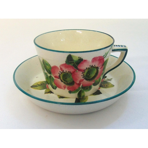 86 - Wemyss cup and saucer decorated with flowers and leaves