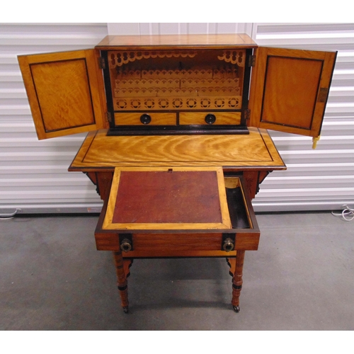 1 - A continental stationery and writing desk of rectangular form with fitted cupboards and drawers on f... 