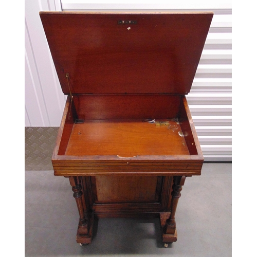 10 - A mahogany Davenport of customary form with four drawers, tooled leather top, hinged writing slope, ... 