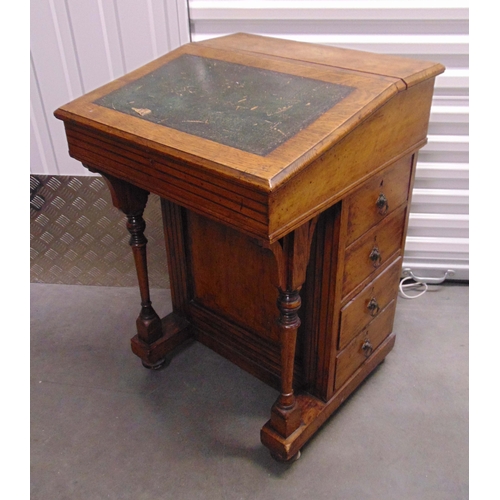 10 - A mahogany Davenport of customary form with four drawers, tooled leather top, hinged writing slope, ... 