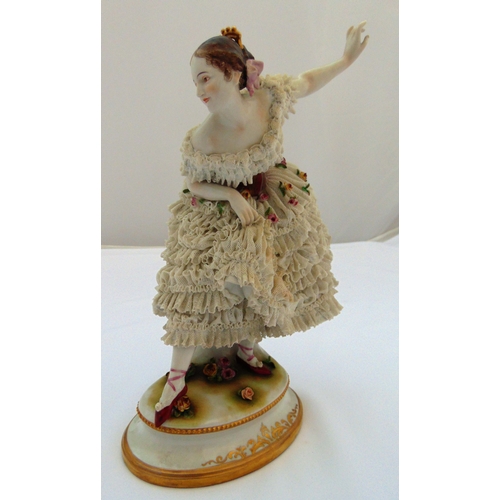 105 - Muller Volkstedt figurine of a dancing lady in a lace dress on raised oval base, 30cm (h)