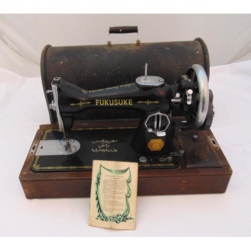 173 - Fukusuke sewing machine in fitted wooden case to include instruction manual