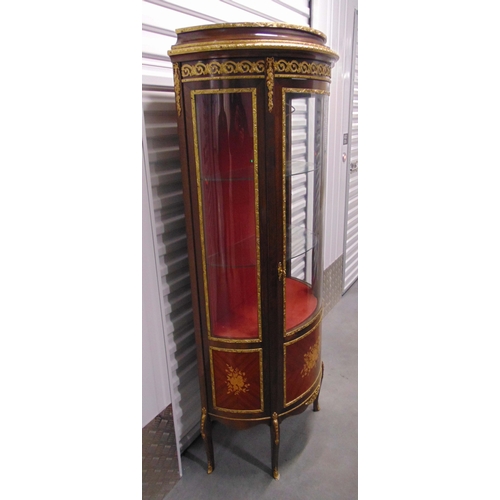 2 - A French style bow fronted Kingswood and mahogany glazed display cabinet with glass shelves, painted... 