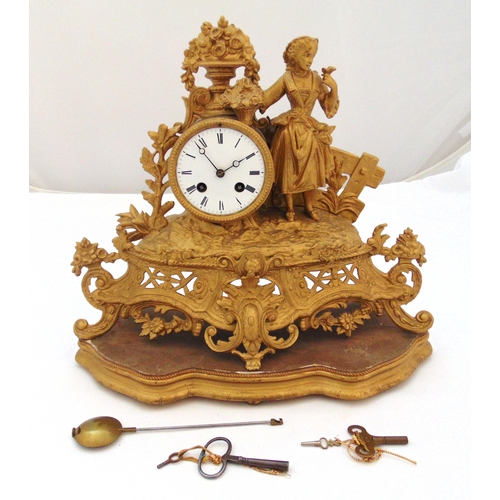 269 - A 19th century gilt metal mantle clock in the form of a maiden holding a basket of flowers in a gard... 