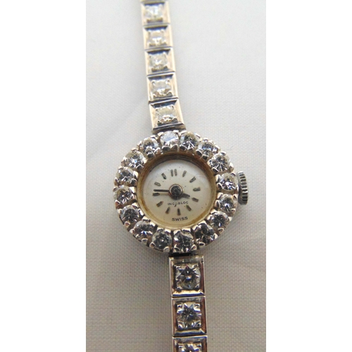 283 - Platinum and diamond ladies wristwatch with articulated platinum and diamond integral bracelet, appr... 