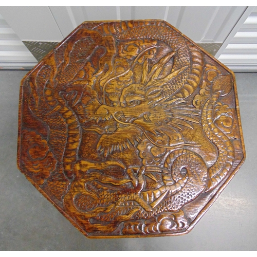 3 - A Chinese hardwood octagonal side table, the top carved with a dragon, all on four cabriole legs. 62... 