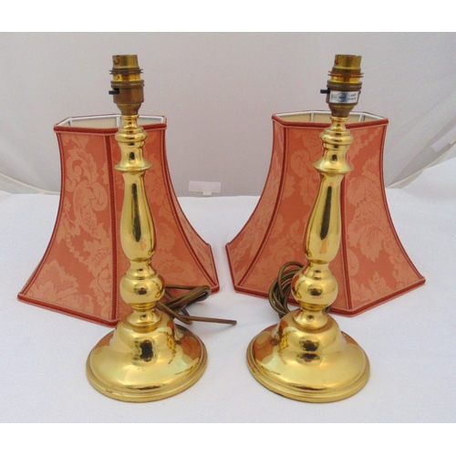 31 - A pair of brass baluster form table lamps on raised circular bases to include silk shades, lamps 35c... 