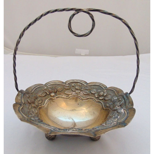 359 - A white metal fruit basket of circular form chased with flowers and leaves central carrying handle o... 