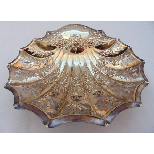 366 - A hallmarked silver shell shaped nut dish, scroll pierced on three ball feet Sheffield 1906, approx ... 