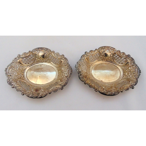 367 - A pair of hallmarked silver shaped oval bonbon dishes pierced and chased with flowers and scrolls Lo... 