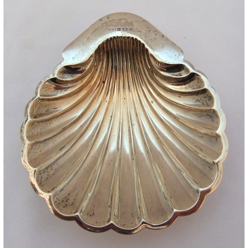 368 - A hallmarked silver shell shaped butter dish on three ball feet Birmingham 1904, approx total weight... 