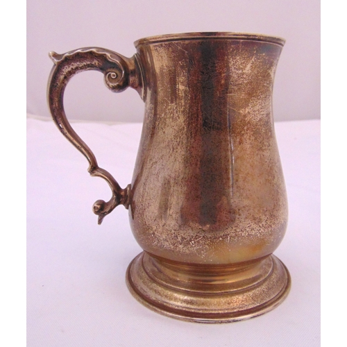 369 - A hallmarked silver tankard of waisted form with scroll handle Birmingham 1966, approx total weight ... 