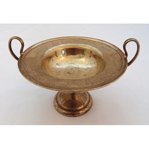 372 - A hallmarked silver tazza with pierced side handles on raised circular base Sheffield 1911, approx t... 