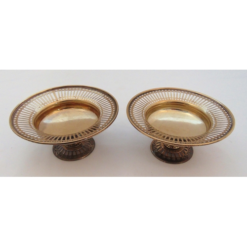 374 - A pair of hallmarked silver pierced bonbon dishes on raised circular bases Birmingham 1906, approx t... 