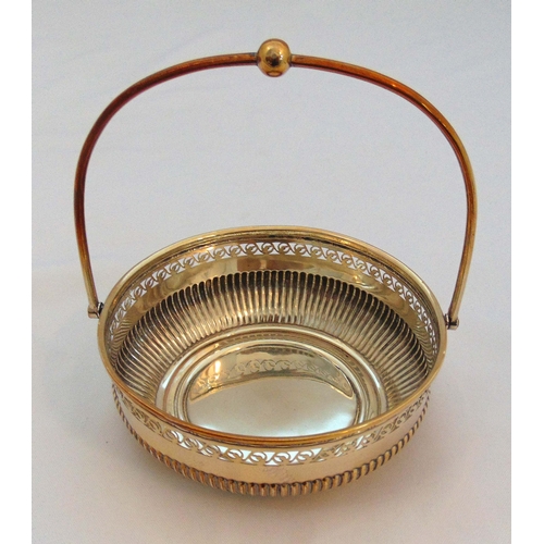 378 - A white metal pierced dish with swing handle and scroll pierced sides, approx total weight 133g