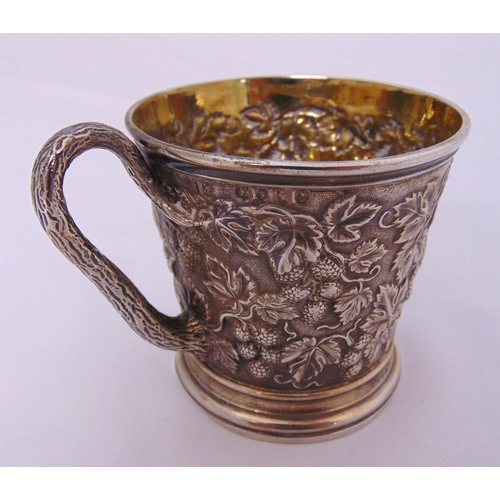 384 - A Victorian hallmarked silver Christening cup of conical form with gilt interior, leaf and berry sid... 