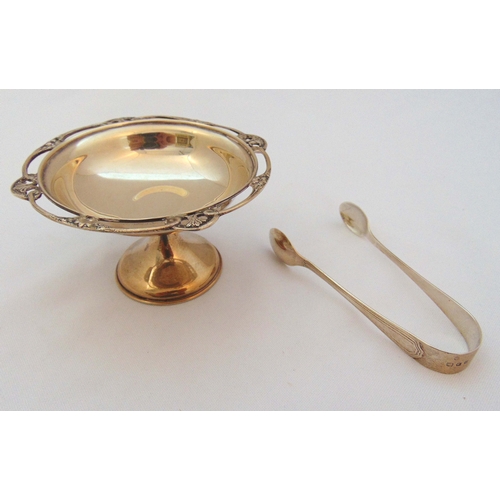 387 - A hallmarked silver bonbon dish on raised circular base London 1925 and a pair of sugar tongs, appro... 