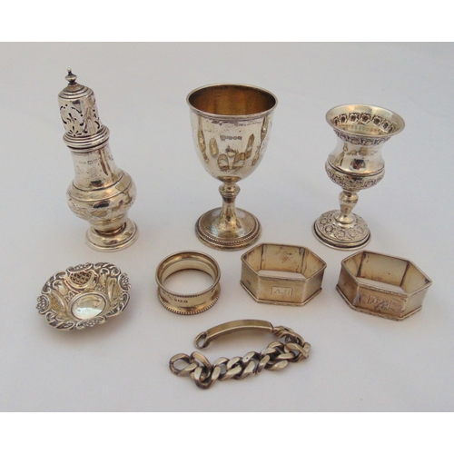 389 - A quantity of hallmarked silver to include two Kiddush cups, a sugar shaker, three napkin rings, a b... 