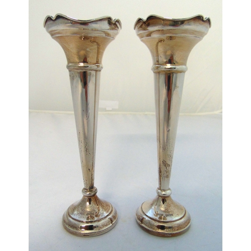 391 - A pair of hallmarked silver stem vases of tapering cylindrical form on raised circular base, Birming... 