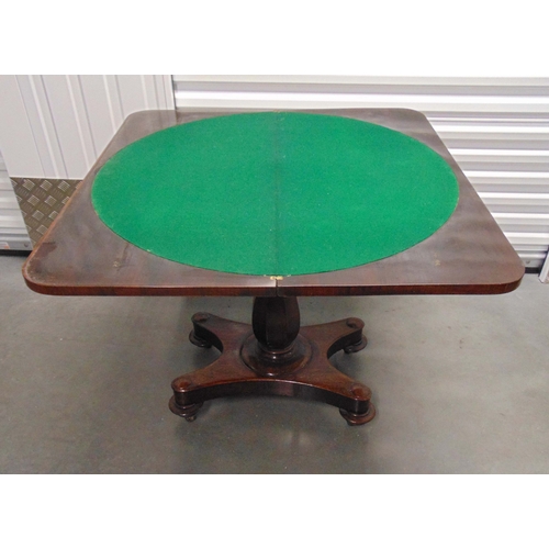 5 - A Victorian rectangular mahogany games table on pedestal base with four bun feet, closed 74 x 92 x 4... 