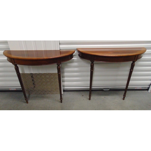 13 - A pair of mahogany demi-lune consol tables on turned wooden supports, 75.5 x 91.5 x 30cm each