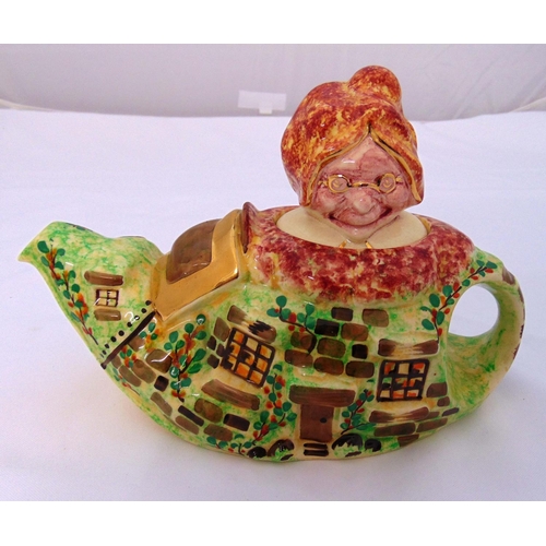 137 - A Lingardware 1930s novelty teapot in the form of Old Mother Hubbard and her cottage, marks to the b... 