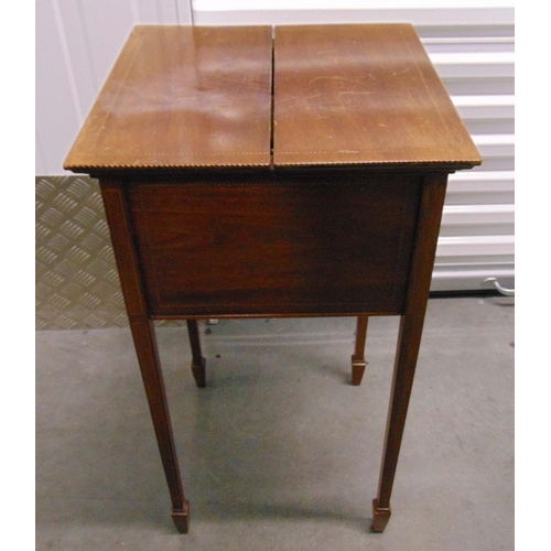 17 - An Edwardian rectangular sewing table with hinged top to reveal fitted interior on four tapering rec... 