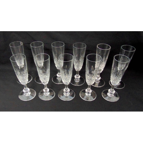 176 - A set of eleven Saint Louis Massenet crystal champagne flutes of customary form, signed to the bases