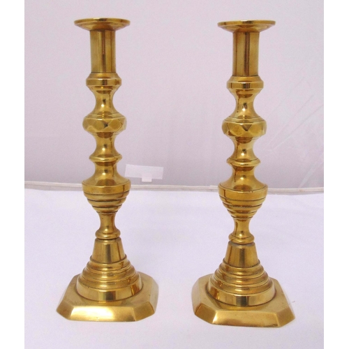 224 - A pair of early 20th century brass knopped stem table candlesticks on raised square bases, 30cm (h)