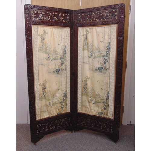 29 - An oriental hardwood floor standing two section double sided folding screen room divider with silk p... 