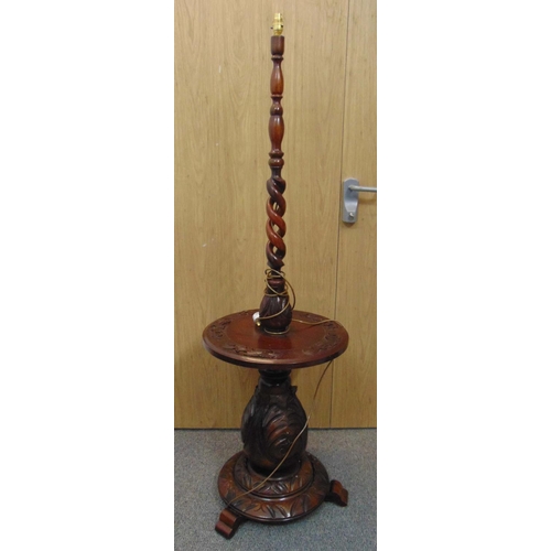 39 - An early 20th century mahogany circular table top with barley twist inset lamp stand all on carved w... 