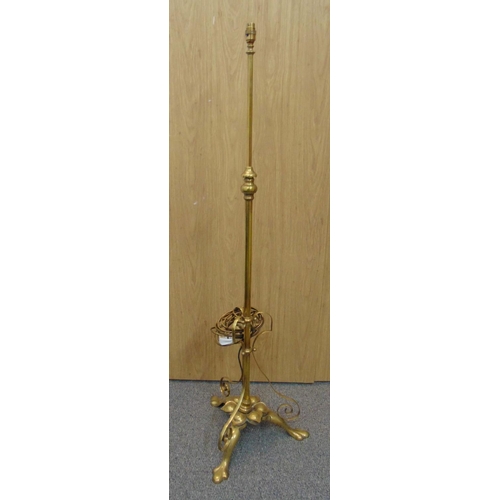 40 - An early 20th century brass telescopic standard lamp on three outswept legs, 147cm (h)