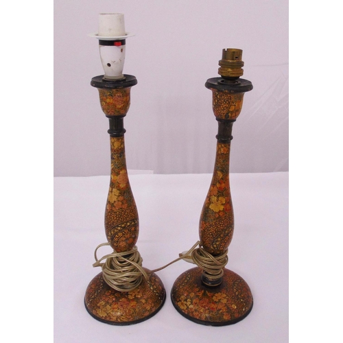 51 - A pair of vintage Kashmiri painted wooden table lamp stands on raised circular bases, 35cm (h)