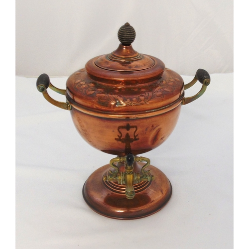 145 - A copper and brass Samovar of vase form with scroll handles, the raised pull off cover with ball fin... 