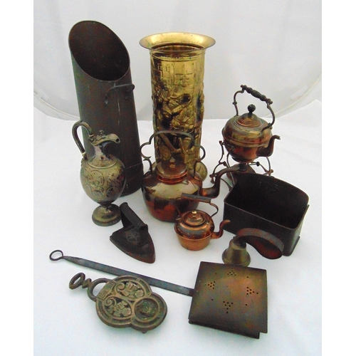 148 - A quantity of brass and copper to include an umbrella stand, a coal scuttle, a tea kettle on stand, ... 