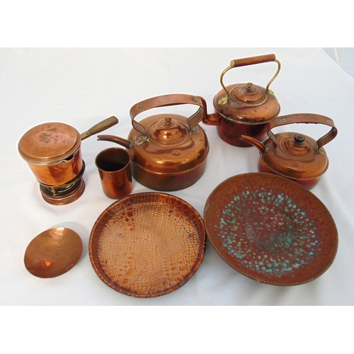 149 - A quantity of copper and brass to include kettles, dishes, water jugs and a cup (8)