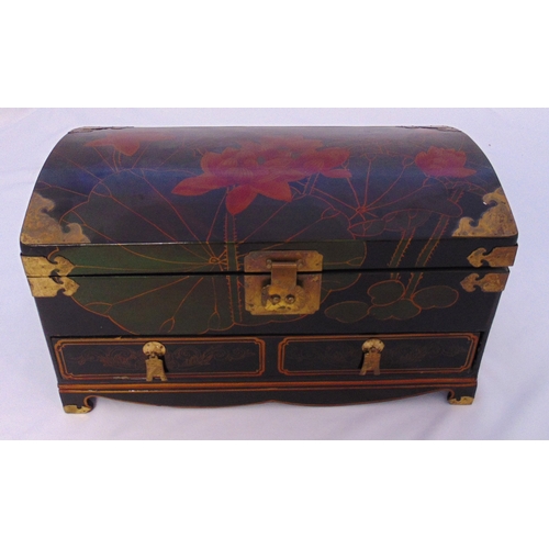 161 - An oriental rectangular lacquered chest with domed hinged top and brass mounts on four bracket feet,... 