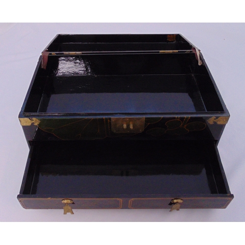 161 - An oriental rectangular lacquered chest with domed hinged top and brass mounts on four bracket feet,... 