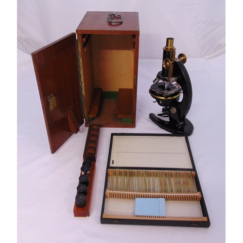163 - Charles Baker of Holborn lacquered and brass microscope in original fitted case with a quantity of p... 