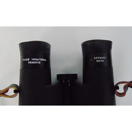 165 - A pair of Leitz binoculars in fitted leather case, 7x 42b 140m/1000m Trinovid 806754