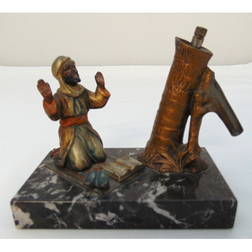 179 - A 1920s Bergman style cigar lamp cold painted bronze of a praying Arab gentleman by a well, mounted ... 