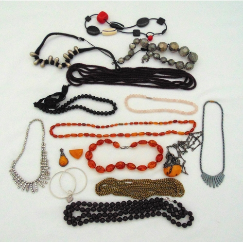 259 - A quantity of costume jewellery necklaces to include amber and jet