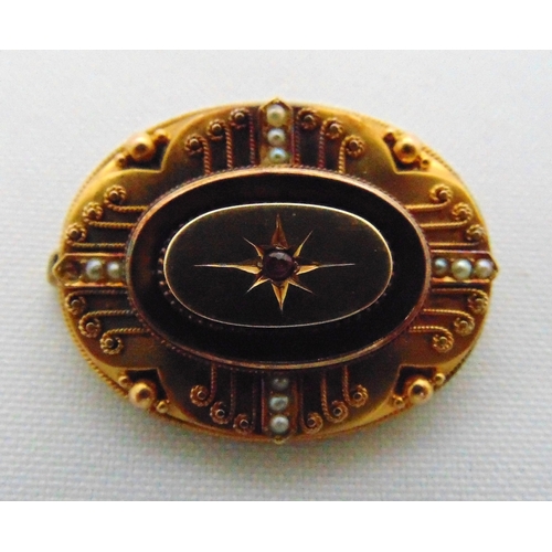 263 - A late Victorian mourning brooch set with a ruby and seed pearls