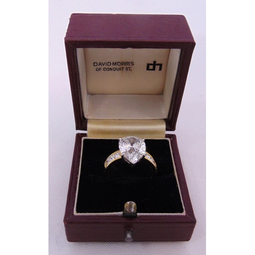 266 - 18ct yellow gold and diamond ring set with a pear shaped diamond approx 4 carats and six princess cu... 