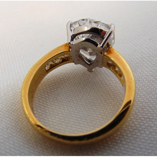 266 - 18ct yellow gold and diamond ring set with a pear shaped diamond approx 4 carats and six princess cu... 