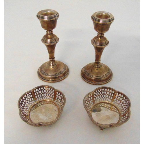 304 - A pair of hallmarked silver bonbon dishes and a pair of hallmarked silver table candlesticks, Birmin... 