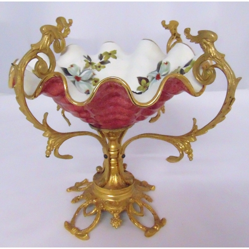 104 - A continental porcelain and gilt metal table centrepiece with naturalistic scrolling arms on open qu... 